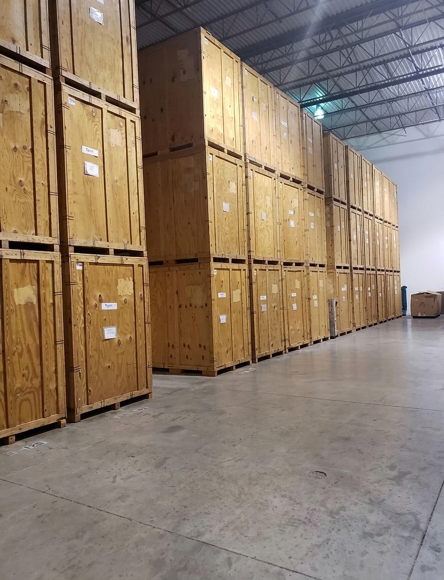 Inside Superman Moving's heated storage warehouse, rows of wooden storage vaults